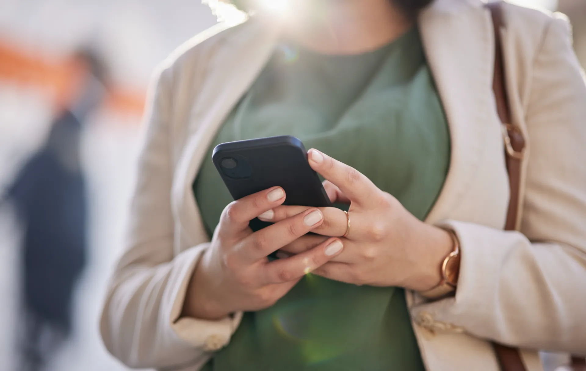 person hands and a phone outdoor for communicatio utc ()